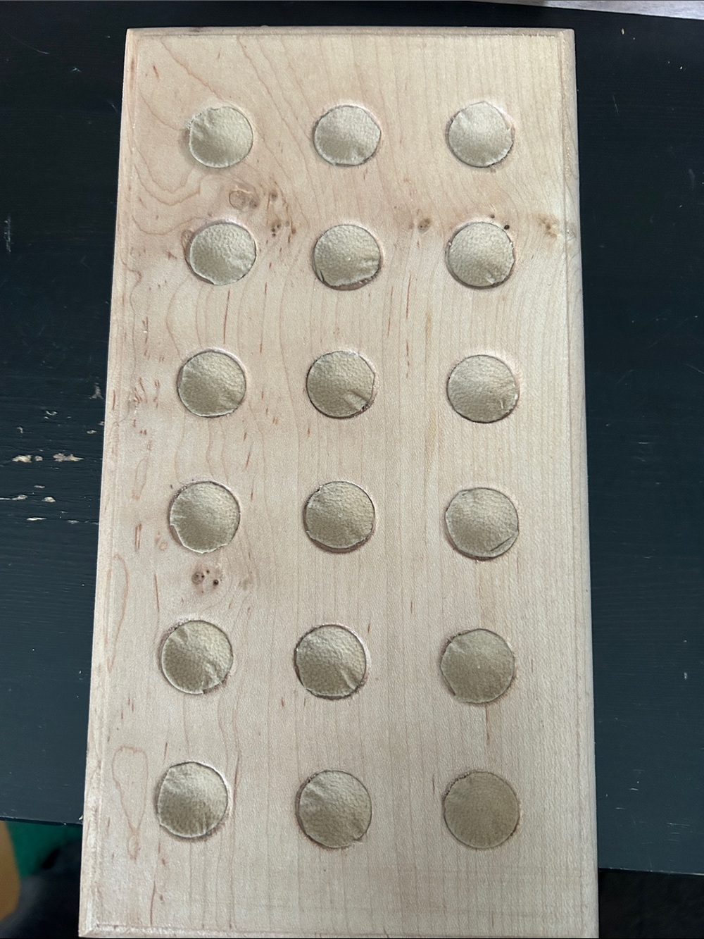 Custom made marble stand out of maple. Felt inserts.